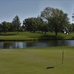 Panoramic view of a lush green golf course at Reflection Ridge Golf Course. Smooth