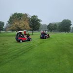 green grass with the flag in the hole.