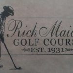Panoramic view of a lush green golf course at Rich Maiden Golf Course. Smooth