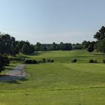 Panoramic view of a lush green golf course at Richland Golf Club. Smooth