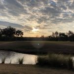 Panoramic view of a lush green golf course at Richmond Hill Golf Club. Smooth