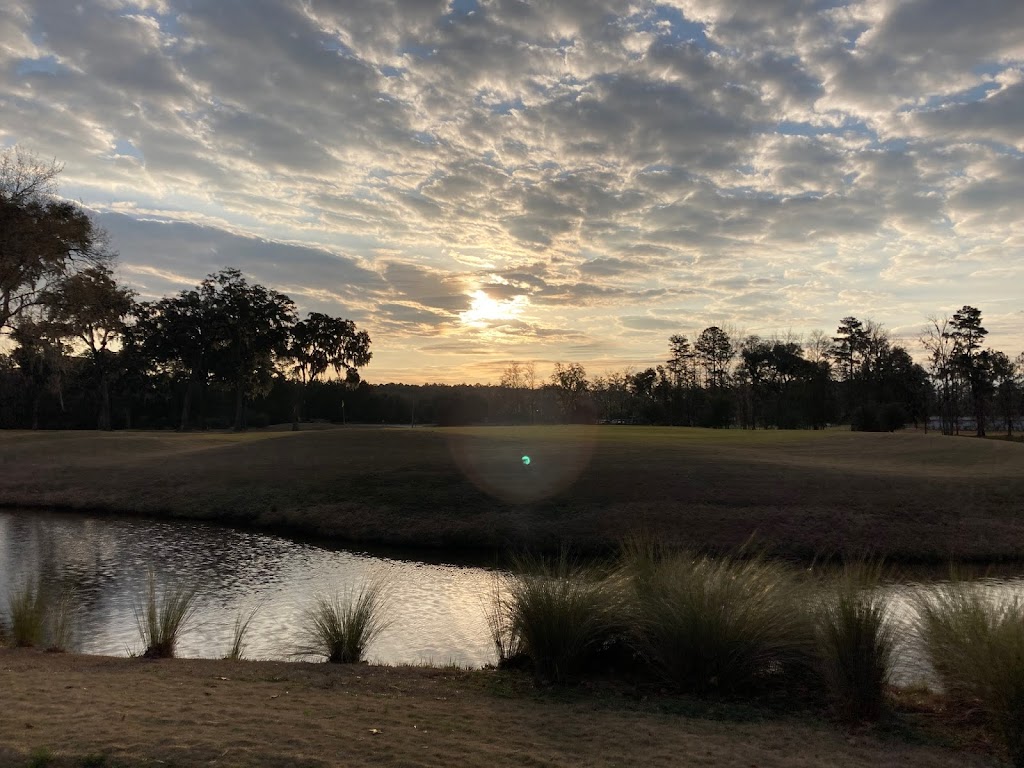 Panoramic view of a lush green golf course at Richmond Hill Golf Club. Smooth