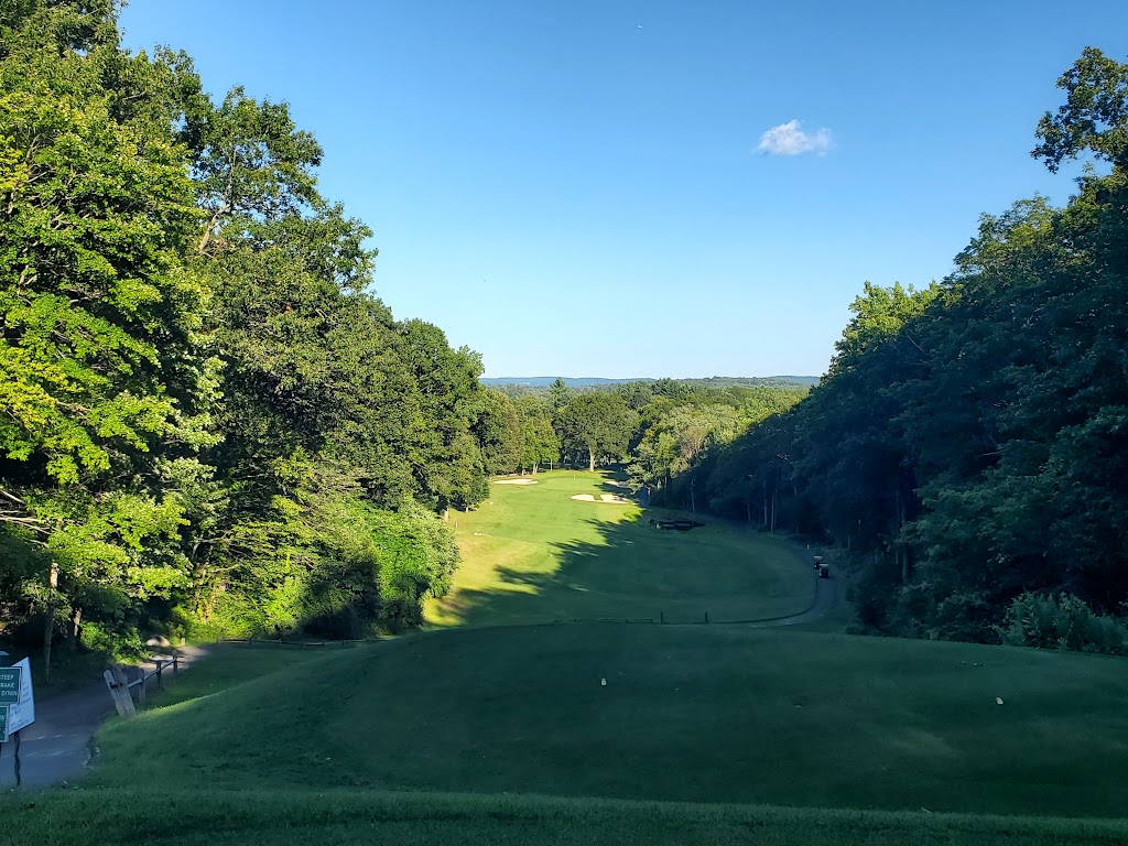 Panoramic view of a lush green golf course at Richter Park Golf Course. Smooth
