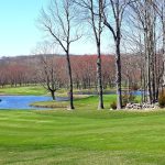 Panoramic view of a lush green golf course at Ridgefield Golf Course. Smooth