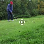 green grass with the flag in the hole.