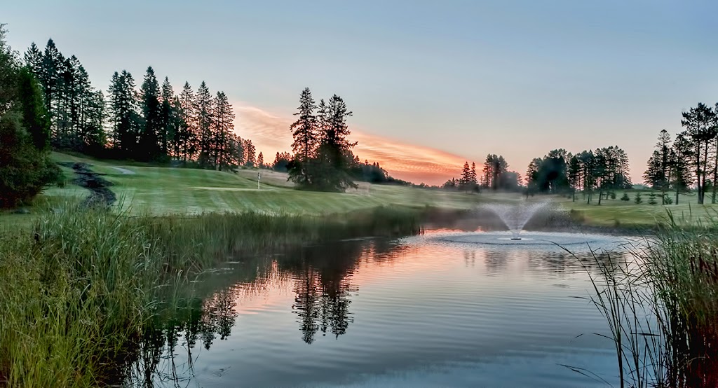 Panoramic view of a lush green golf course at Ridgeview Country Club. Smooth