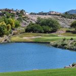 Panoramic view of a lush green golf course at Rio Secco Golf Club. Smooth