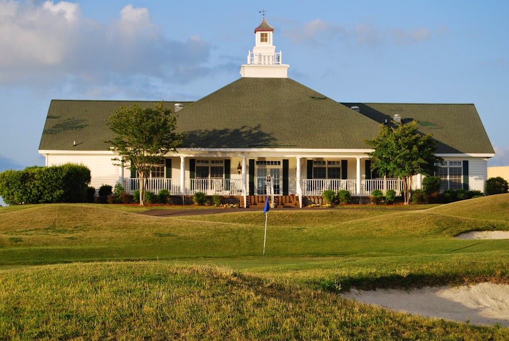Panoramic view of a lush green golf course at River Bend Links. Smooth
