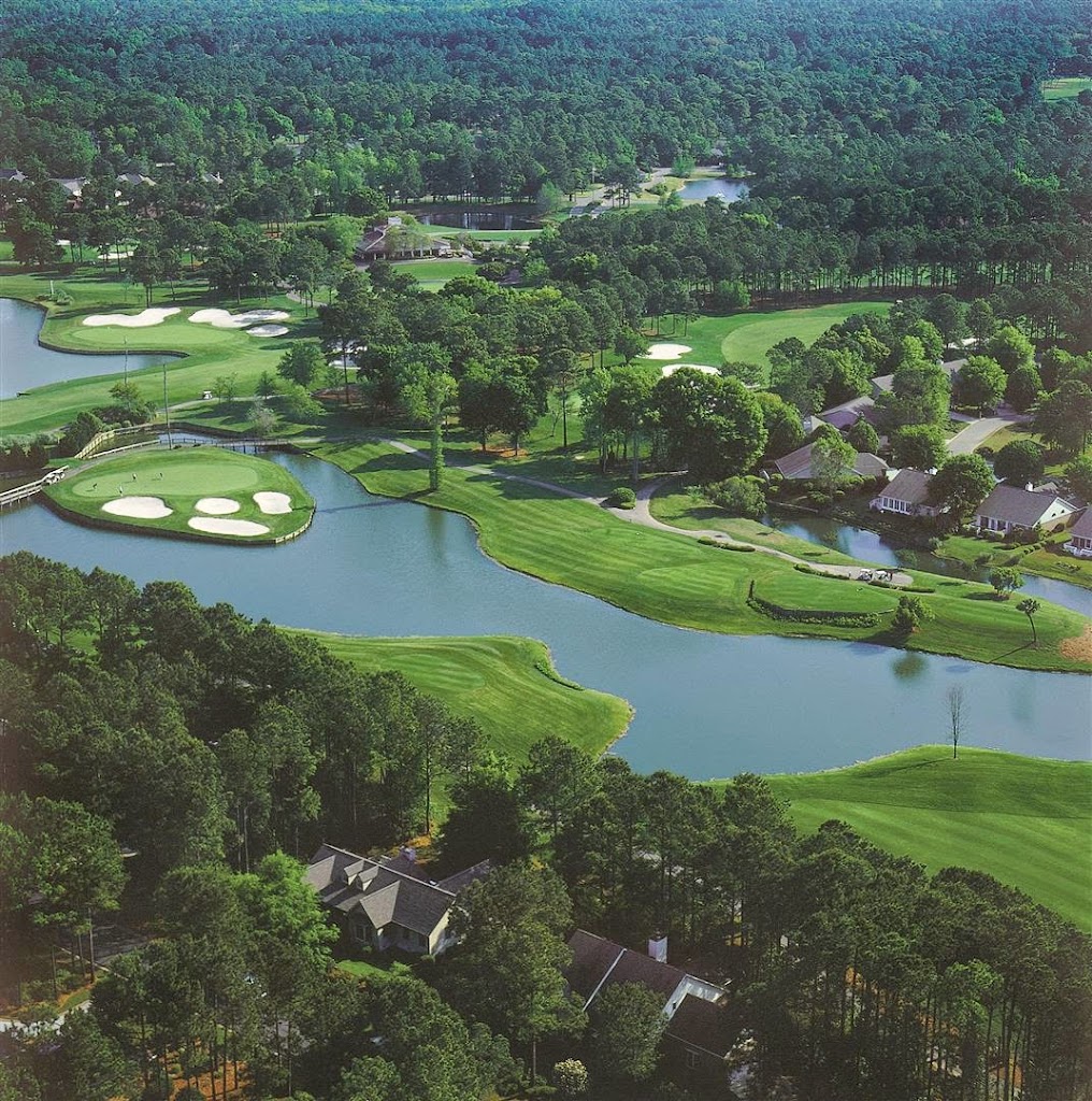 Panoramic view of a lush green golf course at River Club. Smooth