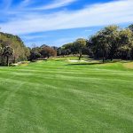Panoramic view of a lush green golf course at River Course Clubhouse & Golf Course. Smooth