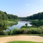 Panoramic view of a lush green golf course at River Forest Golf Club. Smooth