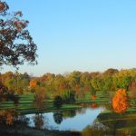 Panoramic view of a lush green golf course at River Glen Country Club. Smooth