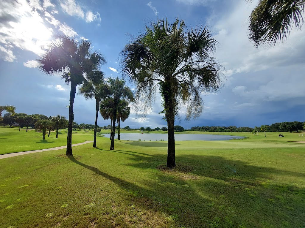 Panoramic view of a lush green golf course at River Greens Golf Course. Smooth
