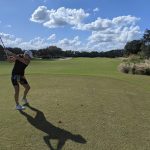 green grass with the flag in the hole.