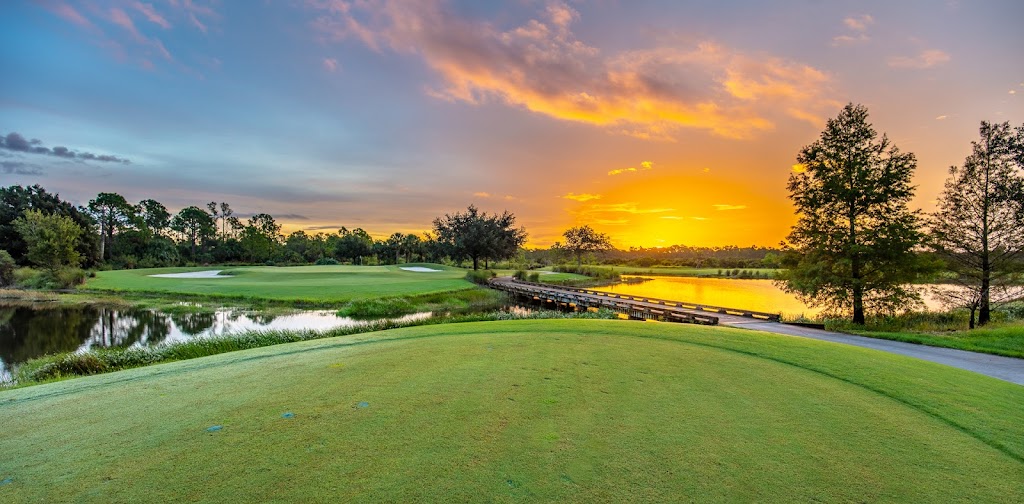 Panoramic view of a lush green golf course at River Hall Country Club. Smooth