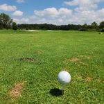 Panoramic view of a lush green golf course at River Marsh Golf Club. Smooth