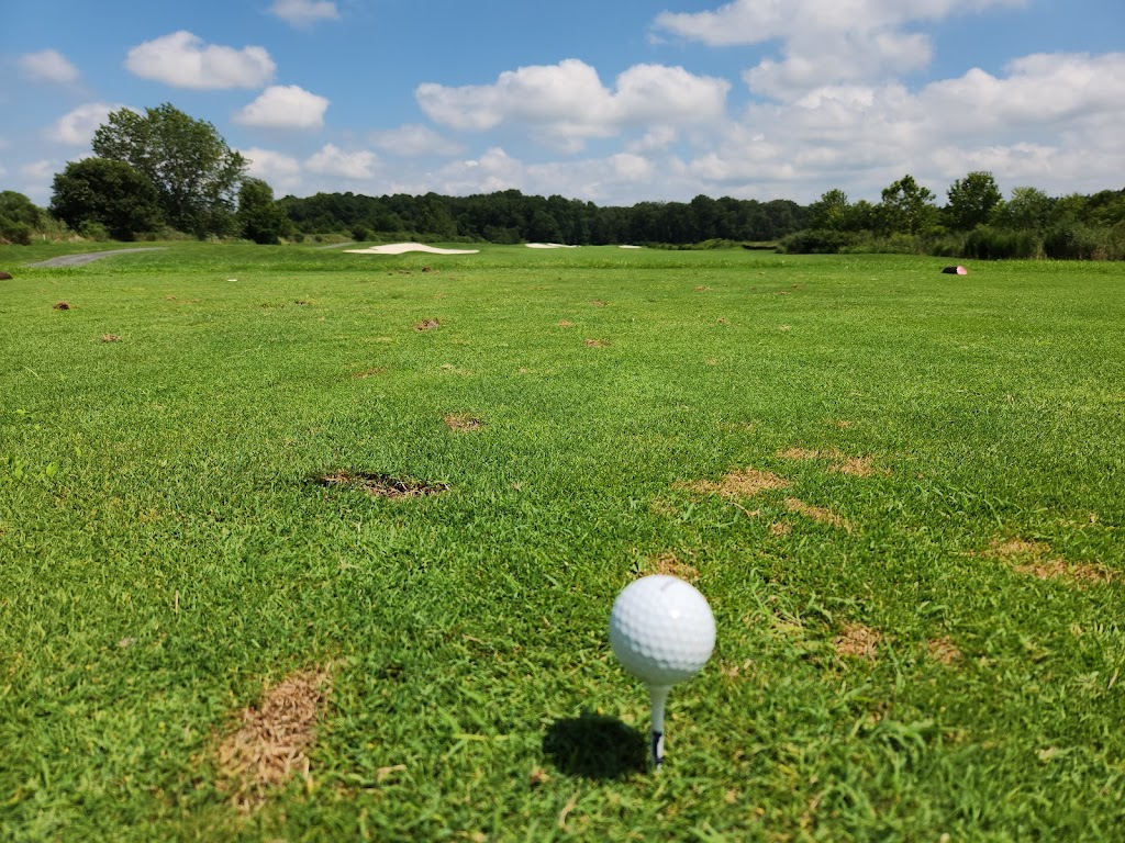 Panoramic view of a lush green golf course at River Marsh Golf Club. Smooth