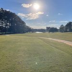 Panoramic view of a lush green golf course at River Pointe Golf Club. Smooth