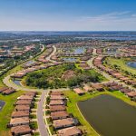 Panoramic view of a lush green golf course at River Strand Golf and Country Club. Smooth