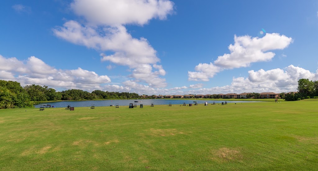 Panoramic view of a lush green golf course at River Strand Golf and Country Club. Smooth