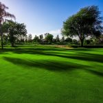 Panoramic view of a lush green golf course at River View Golf Course. Smooth