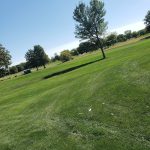 Panoramic view of a lush green golf course at River Wilds Golf Club. Smooth