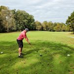 green grass with the flag in the hole.