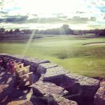 Panoramic view of a lush green golf course at RiverPines Golf. Smooth