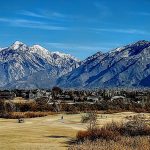 Panoramic view of a lush green golf course at Riverbend Golf Course. Smooth
