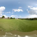 Panoramic view of a lush green golf course at Rivercut Golf Course. Smooth