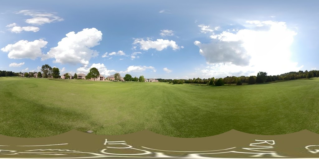 Panoramic view of a lush green golf course at Rivercut Golf Course. Smooth