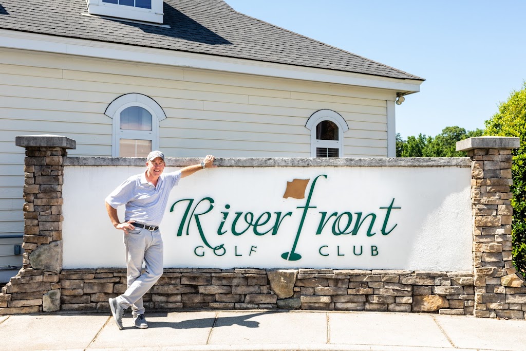 Panoramic view of a lush green golf course at Riverfront Golf Club. Smooth