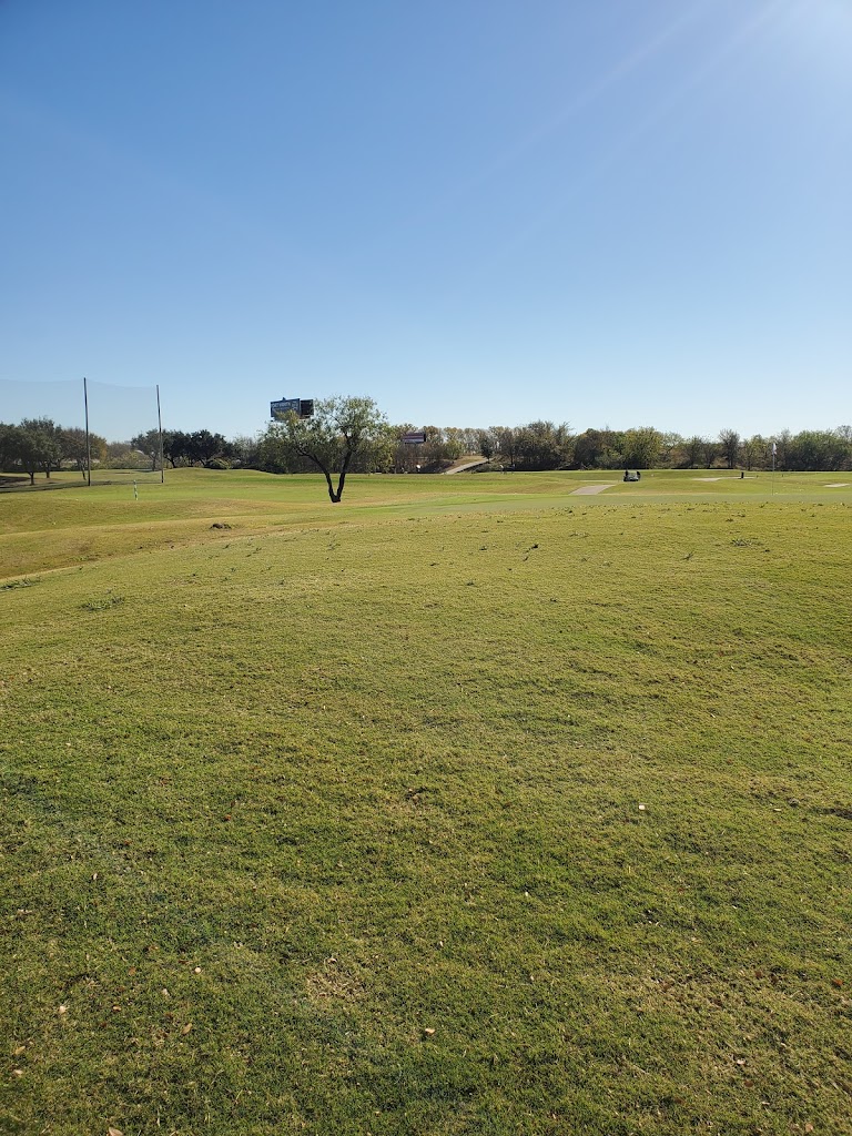 Panoramic view of a lush green golf course at Riverside Golf Club. Smooth