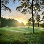Panoramic view of a lush green golf course at Riverton Pointe Golf & Country Club. Smooth