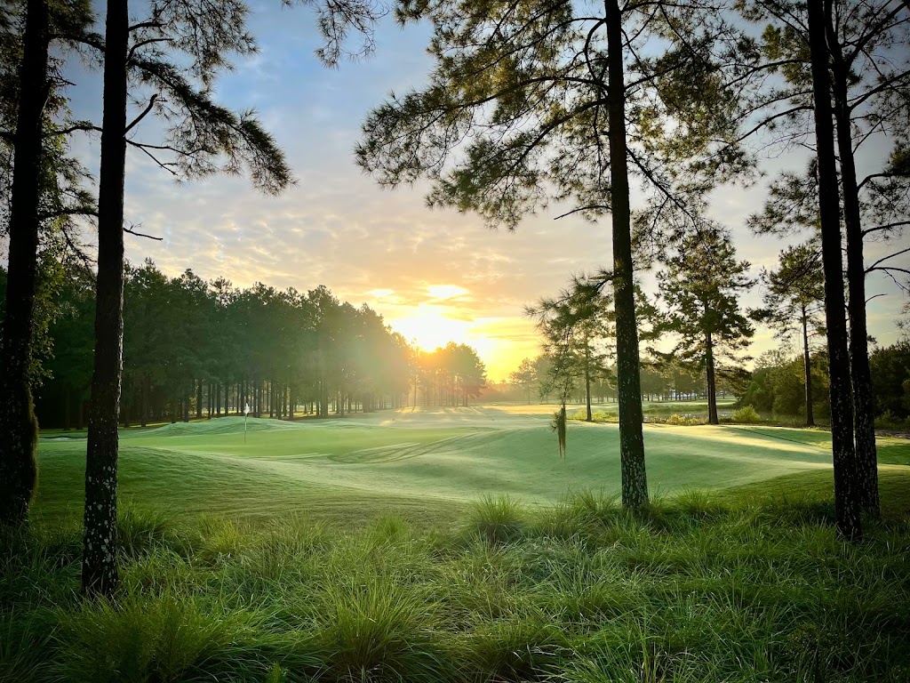 Panoramic view of a lush green golf course at Riverton Pointe Golf & Country Club. Smooth