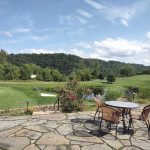 Panoramic view of a lush green golf course at Riverview Country Club. Smooth