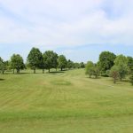 Panoramic view of a lush green golf course at Riverview Golf Course. Smooth