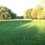 Panoramic view of a lush green golf course at Robert A. Black Golf Club. Smooth