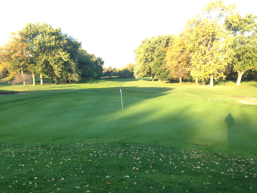 Panoramic view of a lush green golf course at Robert A. Black Golf Club. Smooth