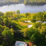 Panoramic view of a lush green golf course at Robert Trent Jones Golf Club. Smooth