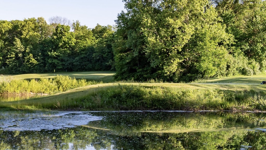 Panoramic view of a lush green golf course at Rock Hollow Golf Club. Smooth