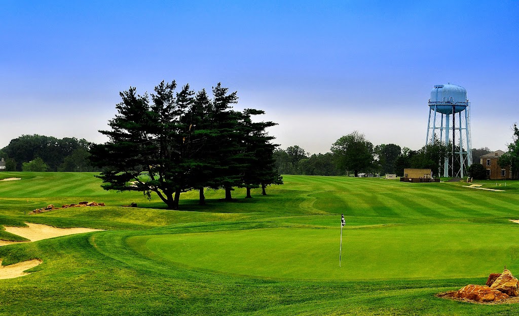 Panoramic view of a lush green golf course at Rock Manor Golf Course. Smooth