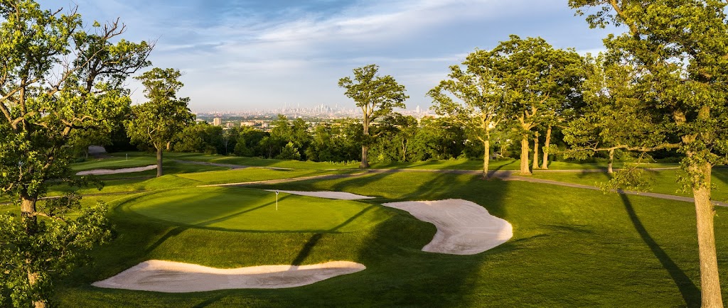 Panoramic view of a lush green golf course at Rock Spring Golf Club. Smooth