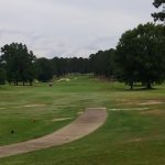 Panoramic view of a lush green golf course at Rocky Branch Golf Club. Smooth
