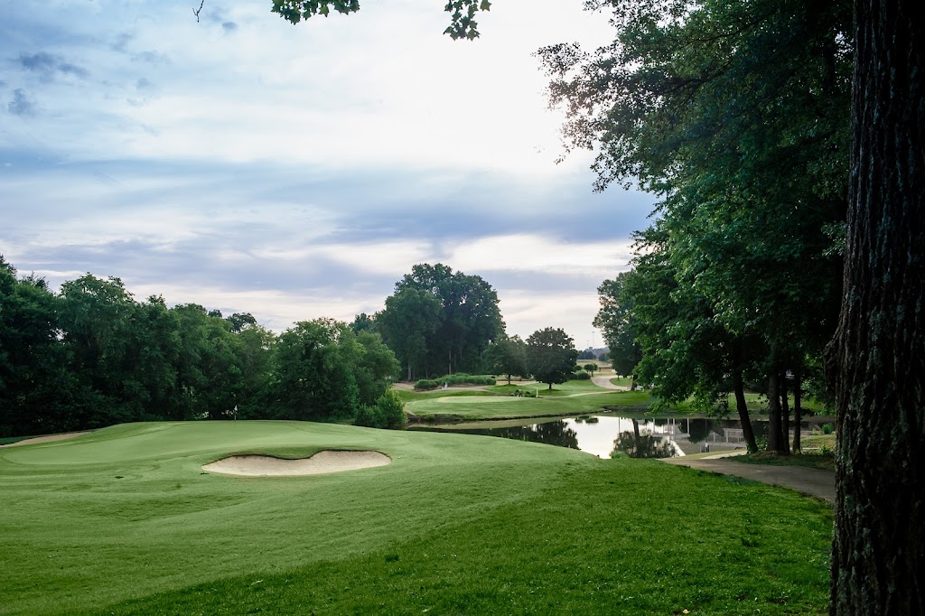 Panoramic view of a lush green golf course at Rocky River Golf Club At Concord. Smooth