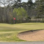 Panoramic view of a lush green golf course at Roebuck Golf Course. Smooth
