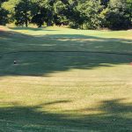 Panoramic view of a lush green golf course at Roman Nose State Park Golf Course. Smooth