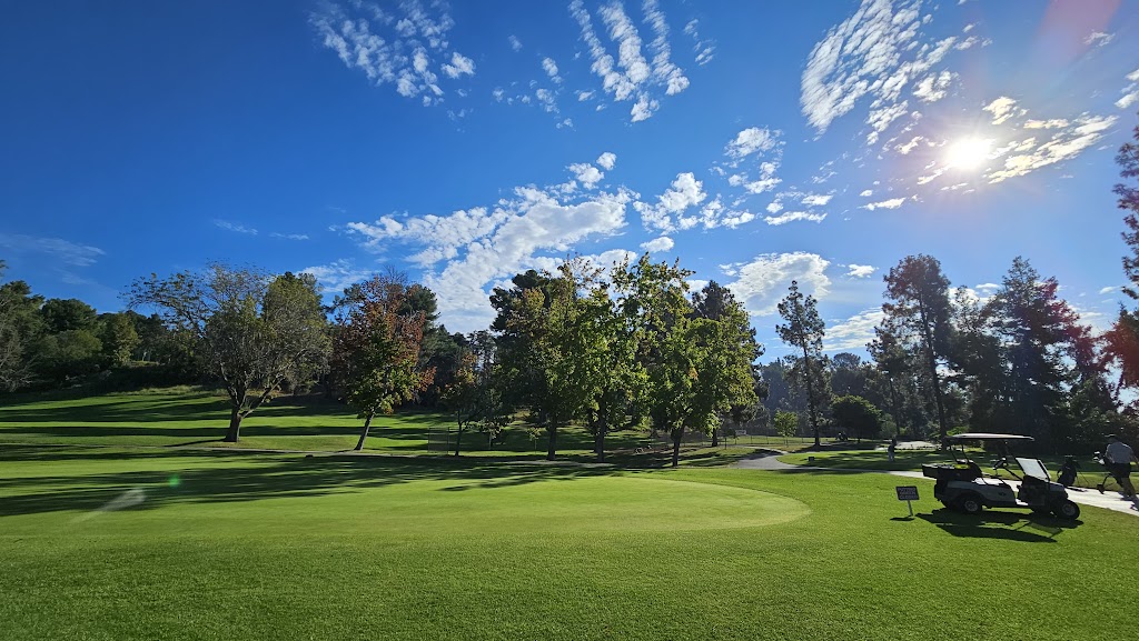 Panoramic view of a lush green golf course at Roosevelt Golf Course. Smooth