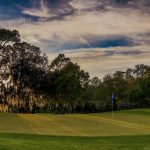 Panoramic view of a lush green golf course at Rosedale Golf & Country Club. Smooth