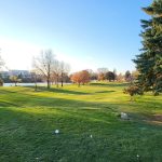 Panoramic view of a lush green golf course at Roseville Cedarholm Golf Course. Smooth